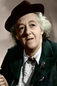 Margaret Rutherford como: Evelyn Summers aka Miss Butterby